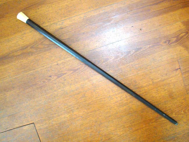 A fine 19th century Captain's rosewood walking stick having an octagonal shaft and octagonal carved whale ivory knob. — image 2